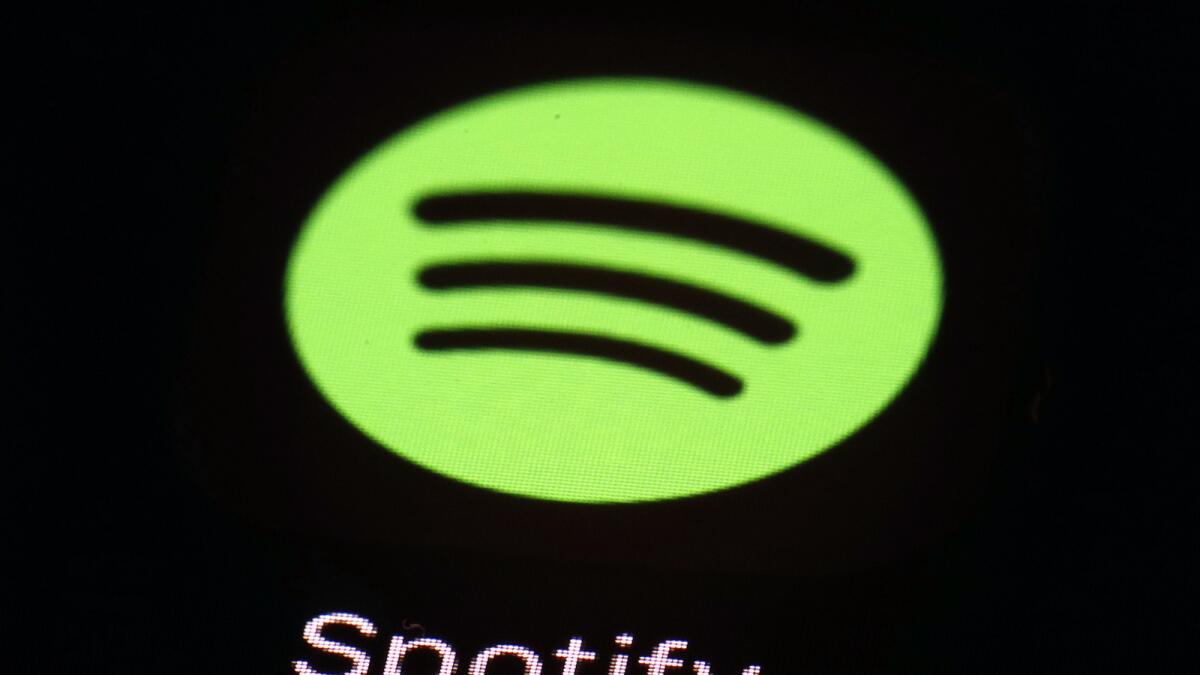 The Spotify app on an iPad is pictured, March 20, 2018, in Baltimore.  — AP file