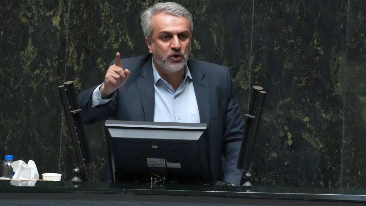 Iranian Industries Minister Reza Fatemi Amin, center, speaks during an open session of parliament for his impeachment, in Tehran, Iran, on Sunday. — AP