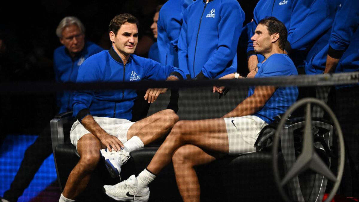 Rafael Nadal (right) with Roger Federer. — Reuters