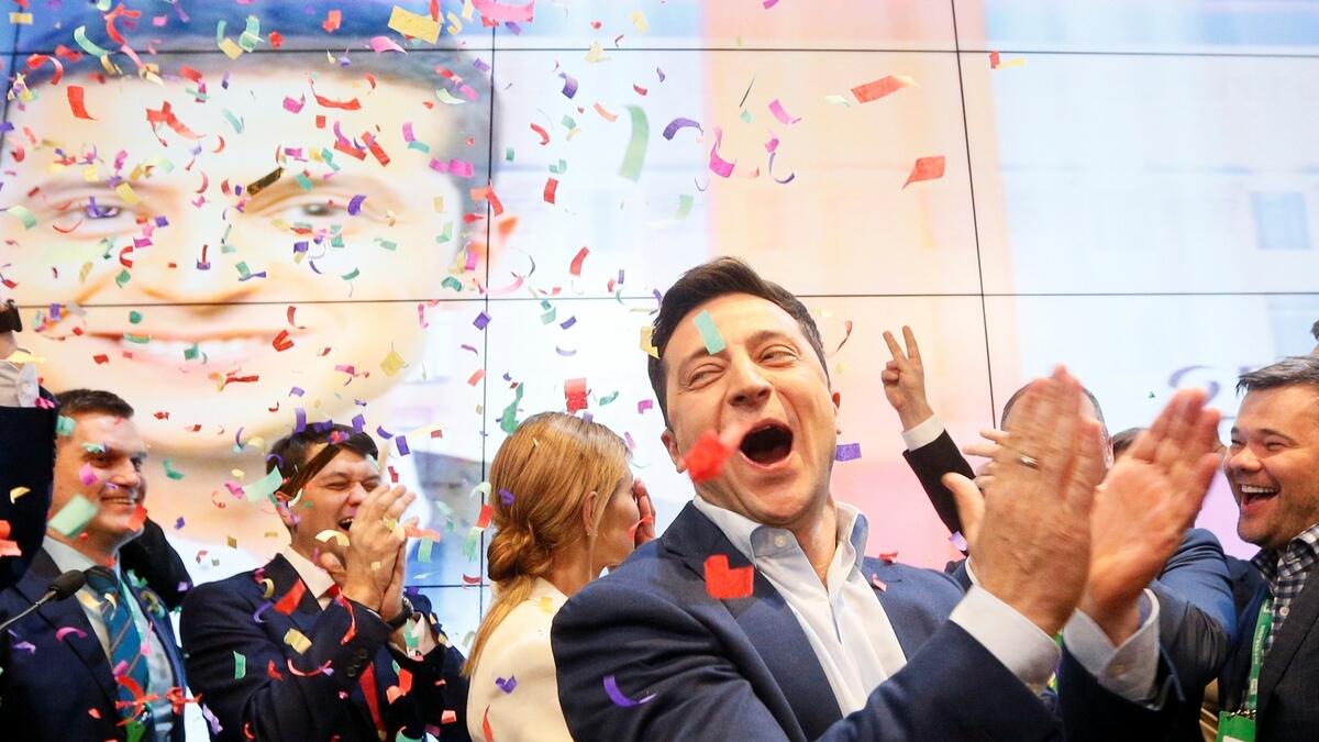 Ukrainian presidential candidate Volodymyr Zelenskiy reacts following the announcement of the first exit poll in a presidential election at his campaign headquarters in Kiev, Ukraine.- Reuters