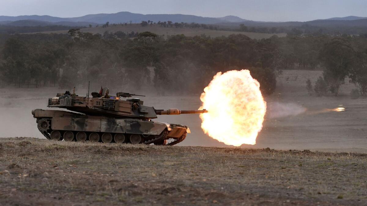 A file photo taken on May 9, 2019 shows an Australian Army M1A1 Abrams main battle tank firing a round at a target during Excercise Chong Ju, a live fire demonstration showcasing the army's joint combined arms capabilities, at the Puckapunyal Military Base some 100 kilometres north of Melbourne. — AFP