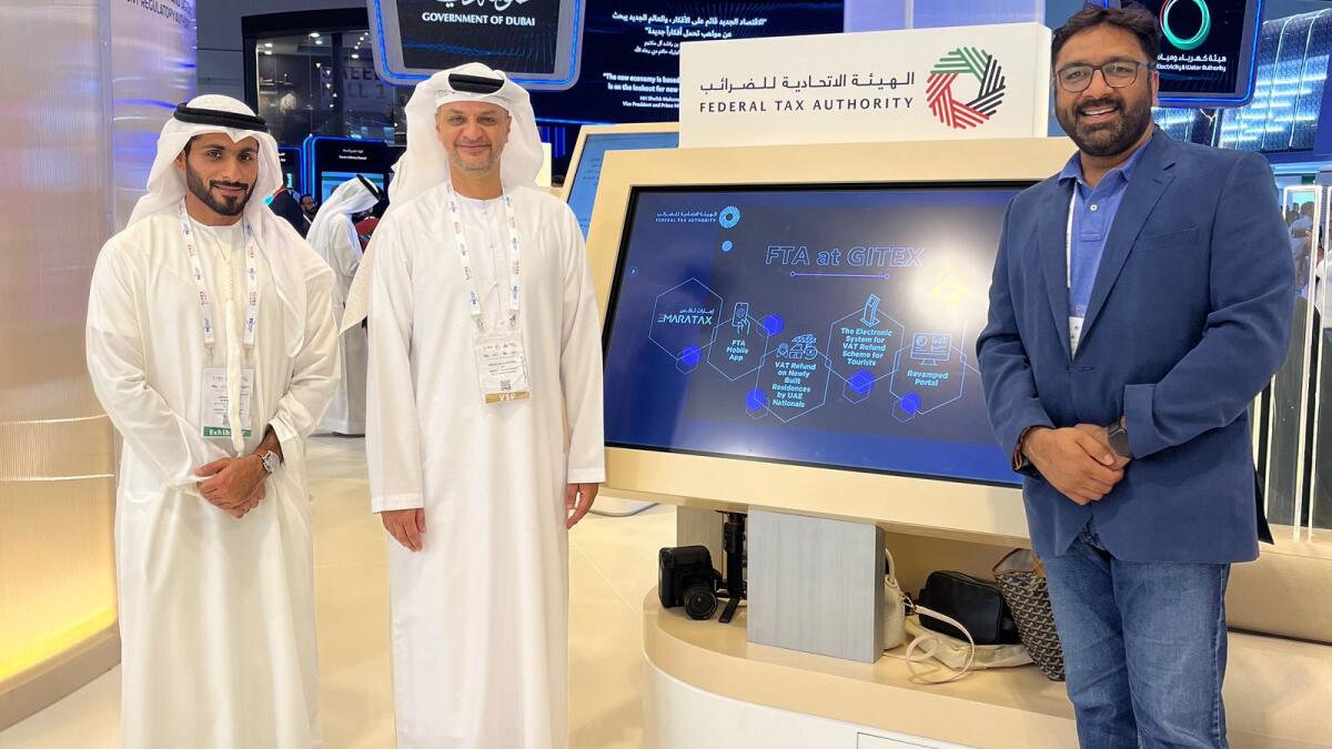Abdullah Al Bastaki, Executive Director of Information Technology at the Federal Tax Authority, Abdul Rahman Karji and Pankaj S Jain at GITEX Global, which concluded on Friday.  - The attached photo