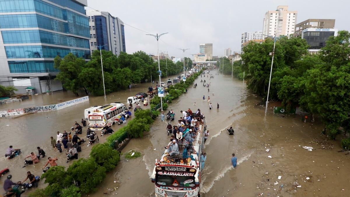 karachi floods, chaos, pakistam, 23, people, killed