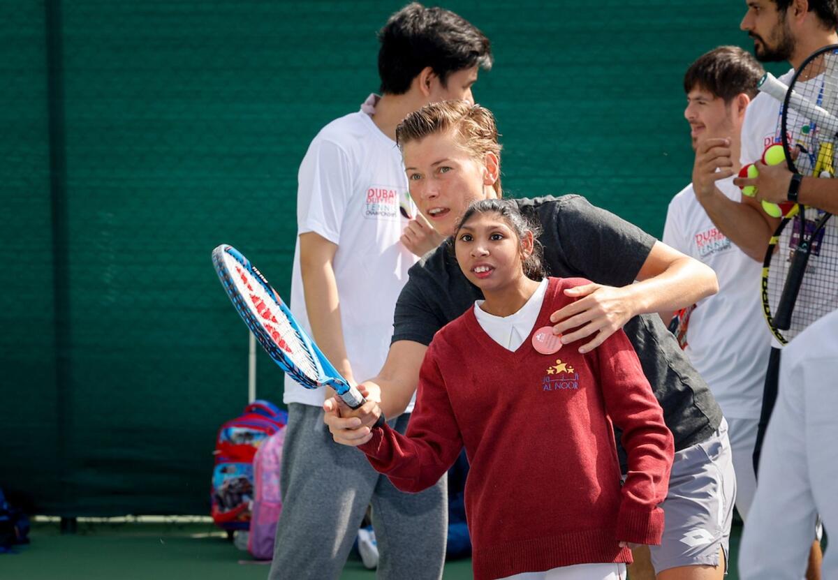 More than 50 children of determination took part in the customised tennis clinic. — Supplied photo