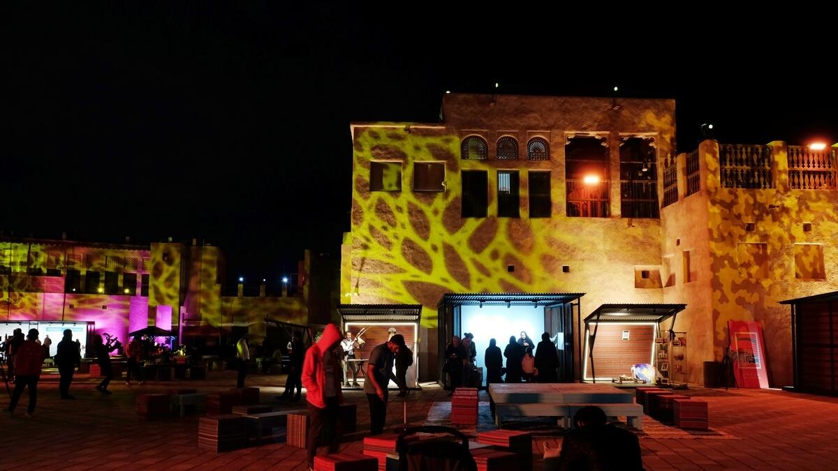 Traditional buildings at Shindagha neighbourhood illuminated during a laser show being held as part of the festival.