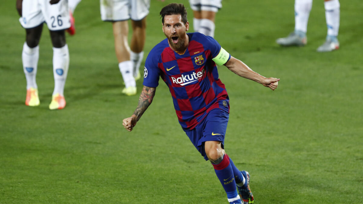 Barcelona's Lionel Messi celebrates after scoring his side's second goal during the Champions League round of 16, second leg match against Napoli. - AP