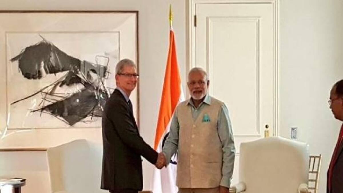Apple CEO meets PM, launches updated Modi app