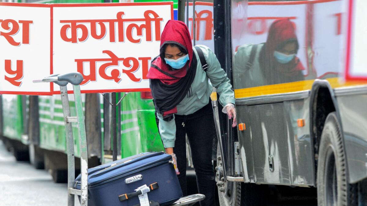 A Nepali migrant worker arrived at the Tribhuvan International airport in Kathmandu. Photo: AFP