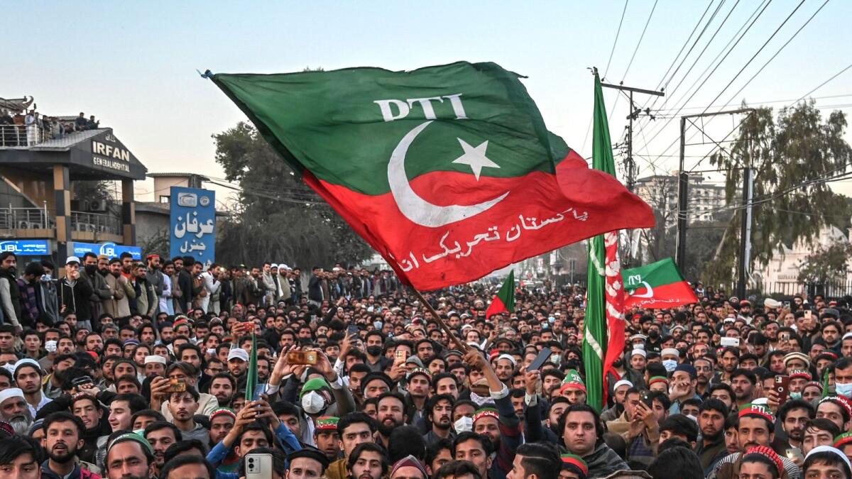 Supporters of Pakistan Tehreek-e-Insaf (PTI) party protest outside the office of a Returning Officer in Peshawar. — AFP