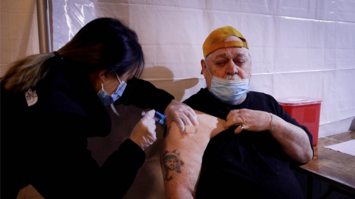 A man receives Covid-19 vaccine in New York. — Reuters