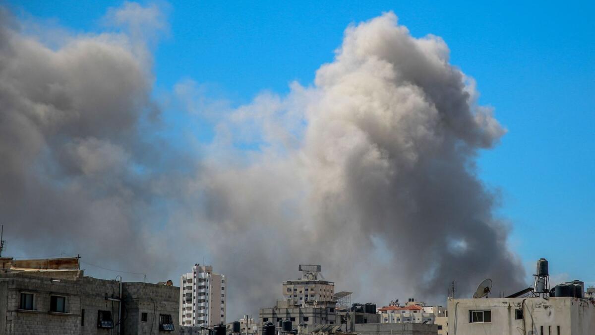 A picture shows smoke billowing after Israeli bombardment in the vicinity of the Al Shifa hospital in Gaza City on Saturday. Photo: AFP