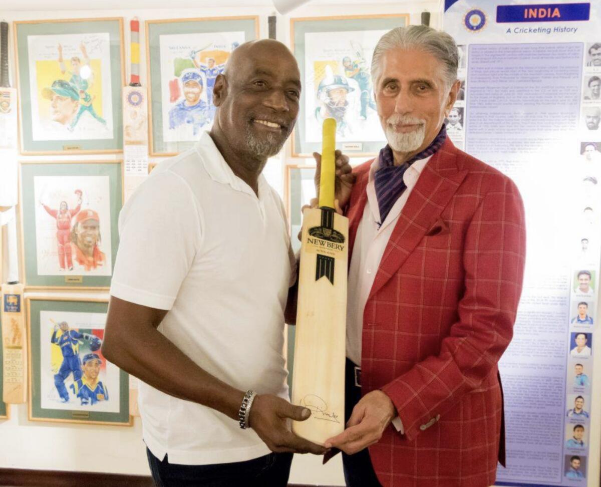 Shyam Bhatia with West Indies legend Sir Vivian Richards at his cricket museum in Dubai. — Facebook