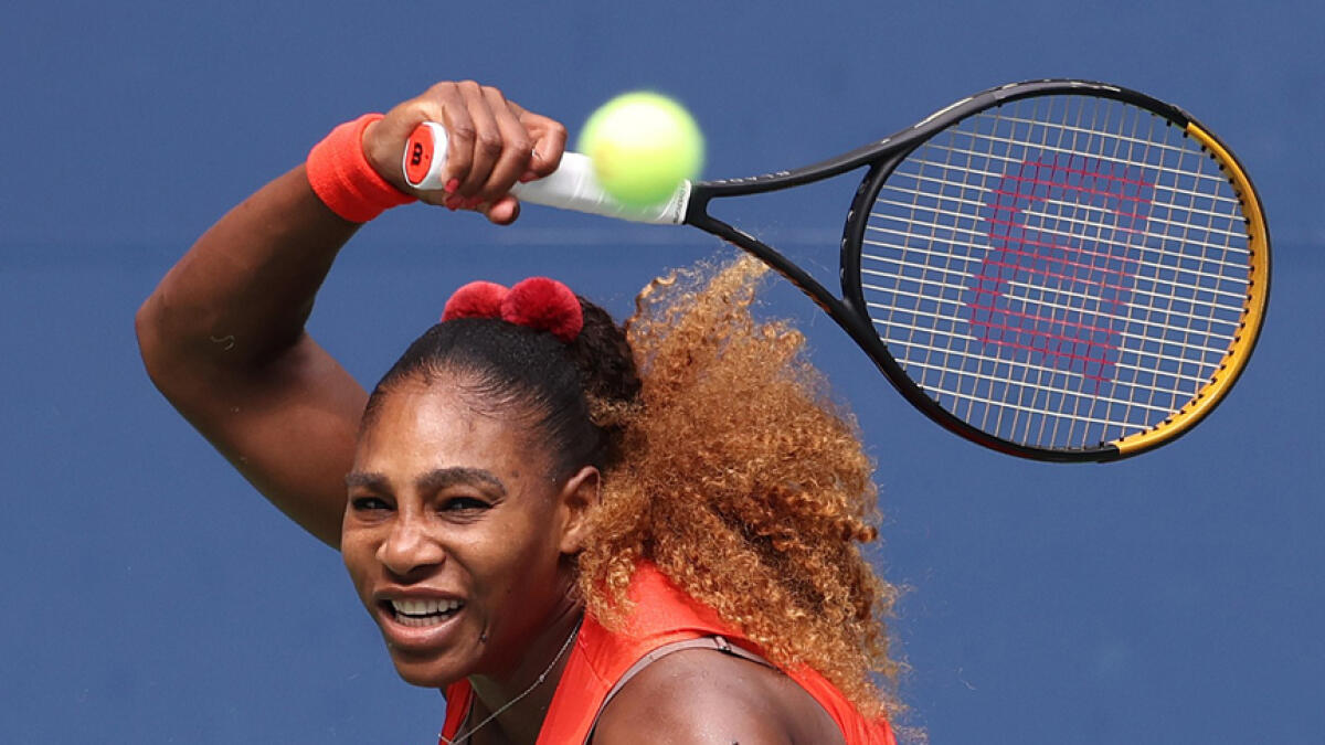 Serena Williams returns the ball during her quarterfinal match against Tsvetana Pironkova. - AFP