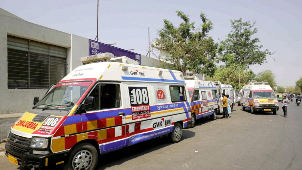 Ambulances carrying patients wait in queue to enter Covid-19 hospital in Ahmedabad. — Reuters