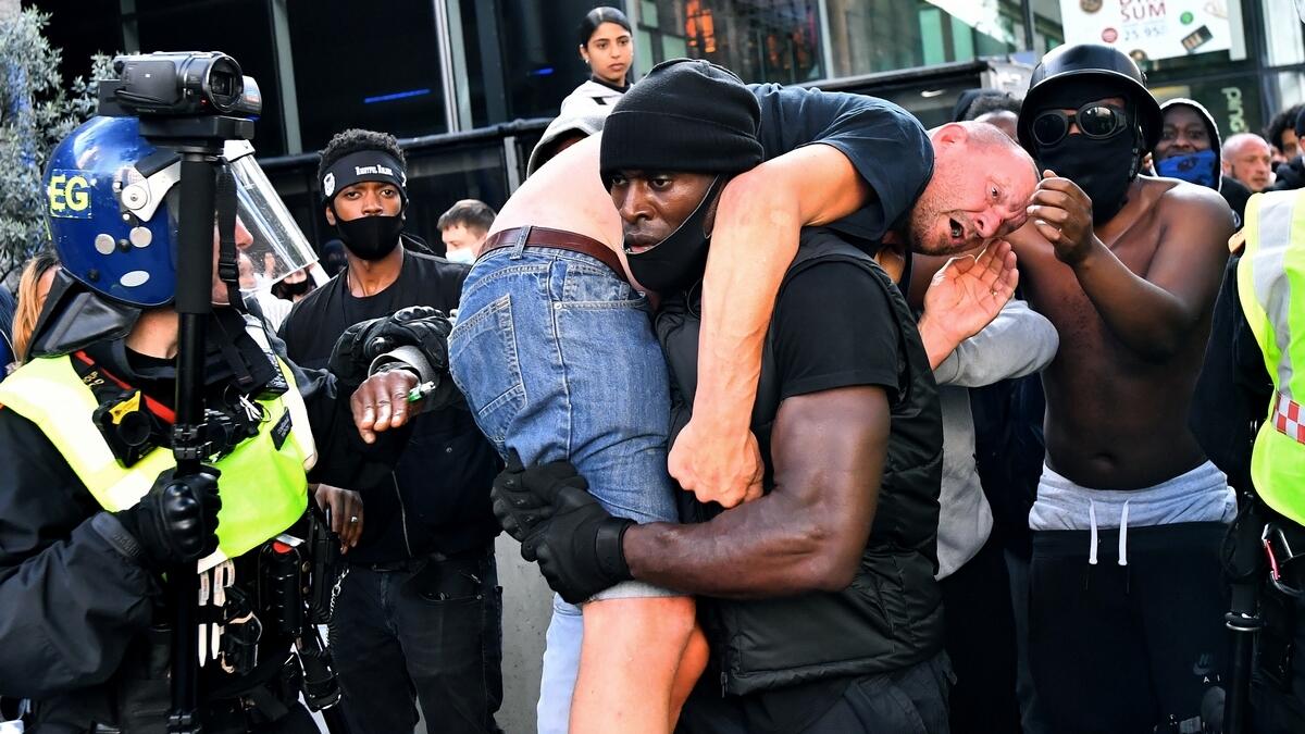 Patrick Hutchinson, black, protester, carrying, white man, anti-racism, protest, far-right, opponents, Reuters, photo, viral, London, Britain
