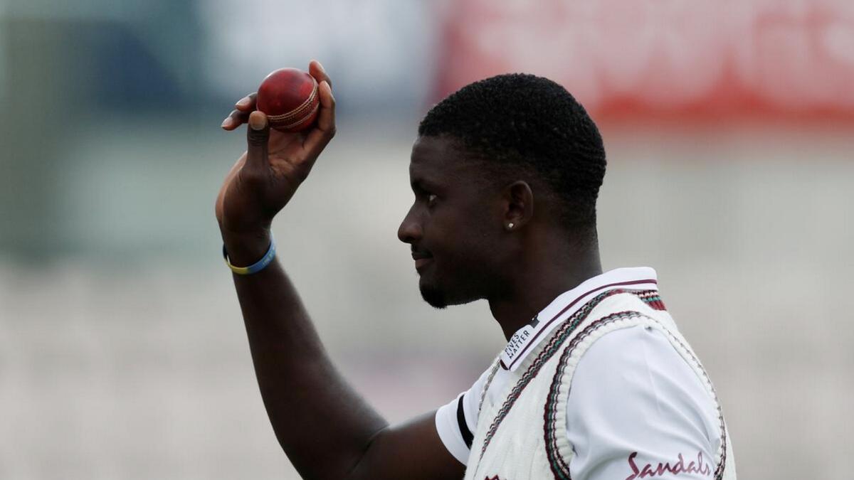 West Indies captain Jason Holder celebrates with the ball after England's first innings. - Reuters
