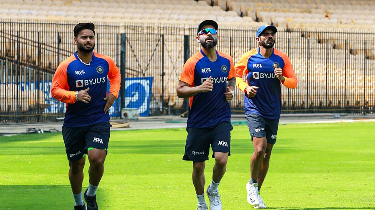 Indian captain Virat Kohli warms up with teammates ahead of a training in Chennai. (PTI)