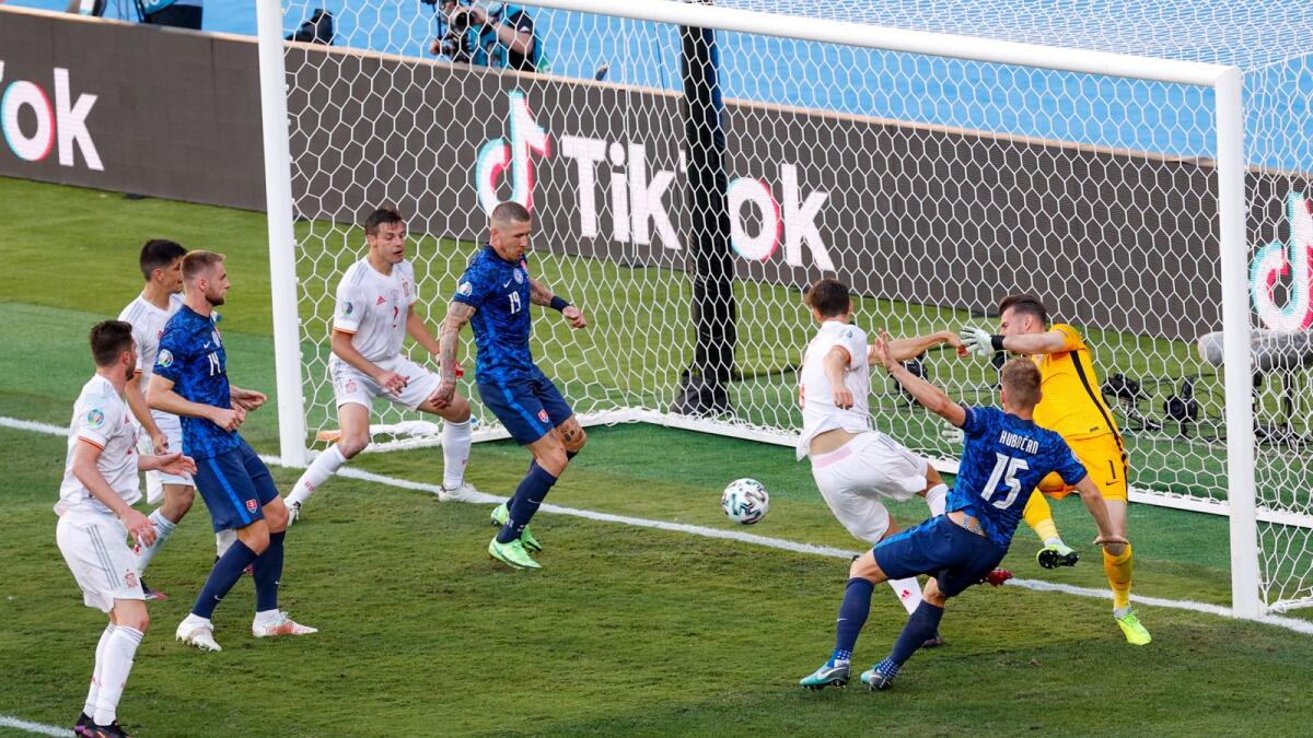 Slovakia's midfielder Juraj Kucka (fourth right) scores an own goal against Spain during their Euro 2020 Group E match on Tuesday. (AFP)