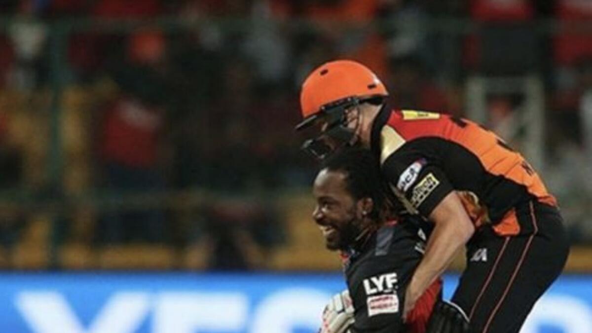 Gayle and Warner share a light moment during a match in the IPL. - Twitter