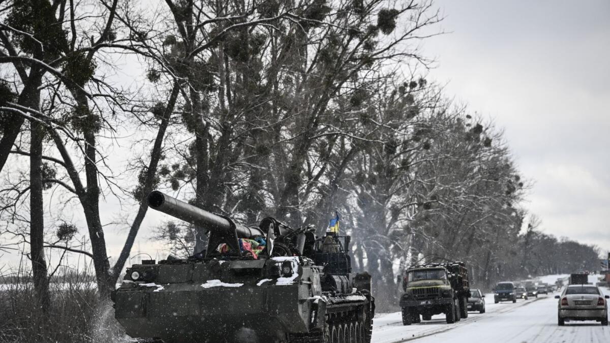 An Ukrainian tank rolls along a main road on March 8, 2022. Photo: AFP