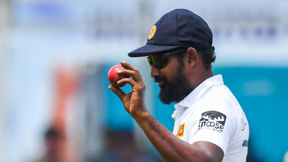 Sri Lanka's Prabath Jayasuriya celebrates after taking six wickets during the second day of second Test against Australia at the Galle International Cricket Stadium on Saturday. — AFP