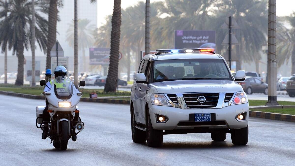 Police patrol car and bike in action on the Sharjah roads