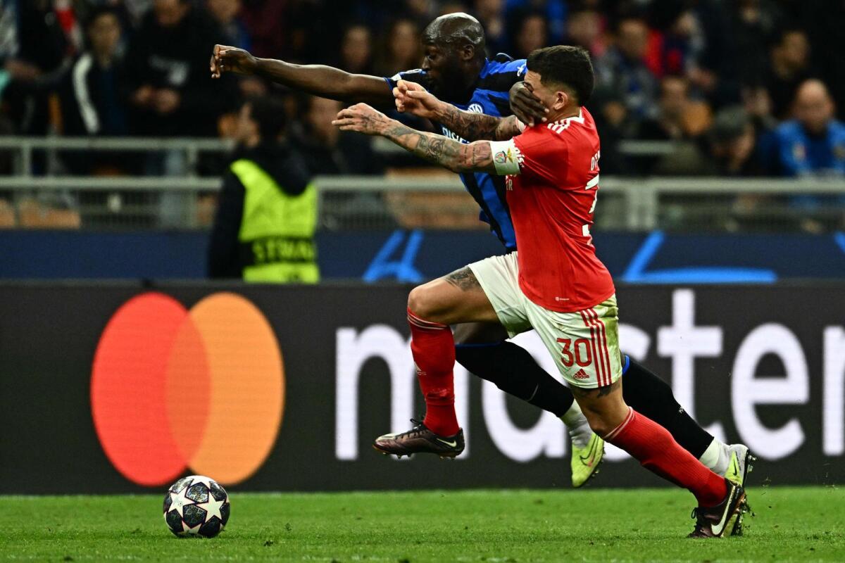 Inter Milan's Romelu Lukaku (left) and Benfica's Nicolas Otamendi tussle for the ball. — AFP