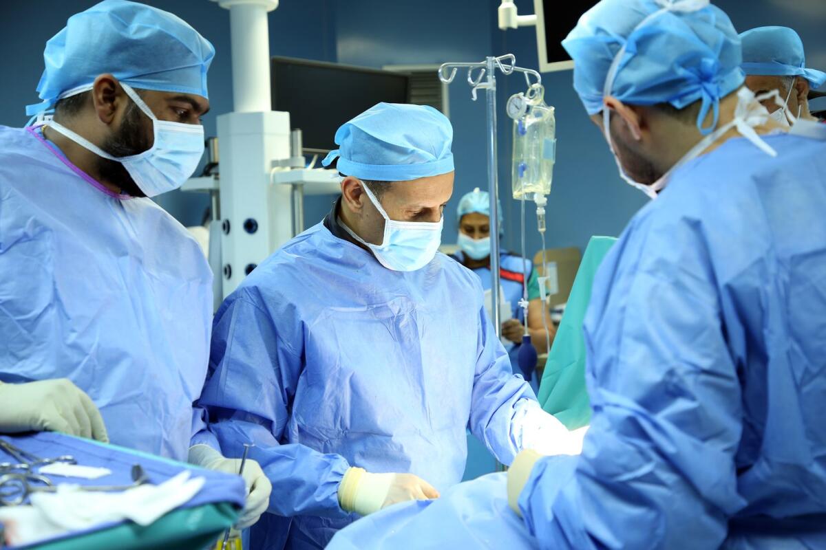 Dr. Firas M. Husban along with the medical team during the surgery