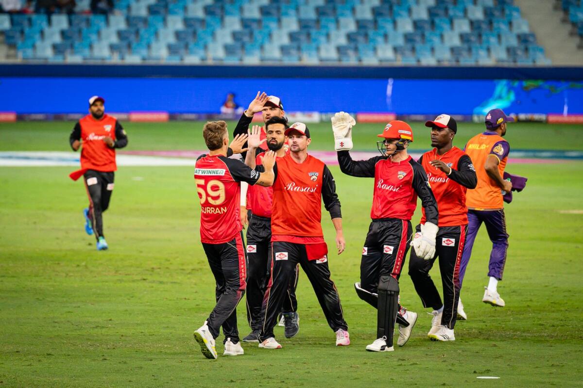 Desert Vipers players celebrate a wicket against Abu Dhabi Knight Riders at the Dubai International Stadium. — Photo by Neeraj Murali
