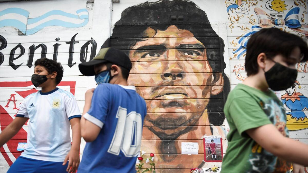 People gather to mourn the death of Diego Maradona in Buenos Aires.  (Reuters)