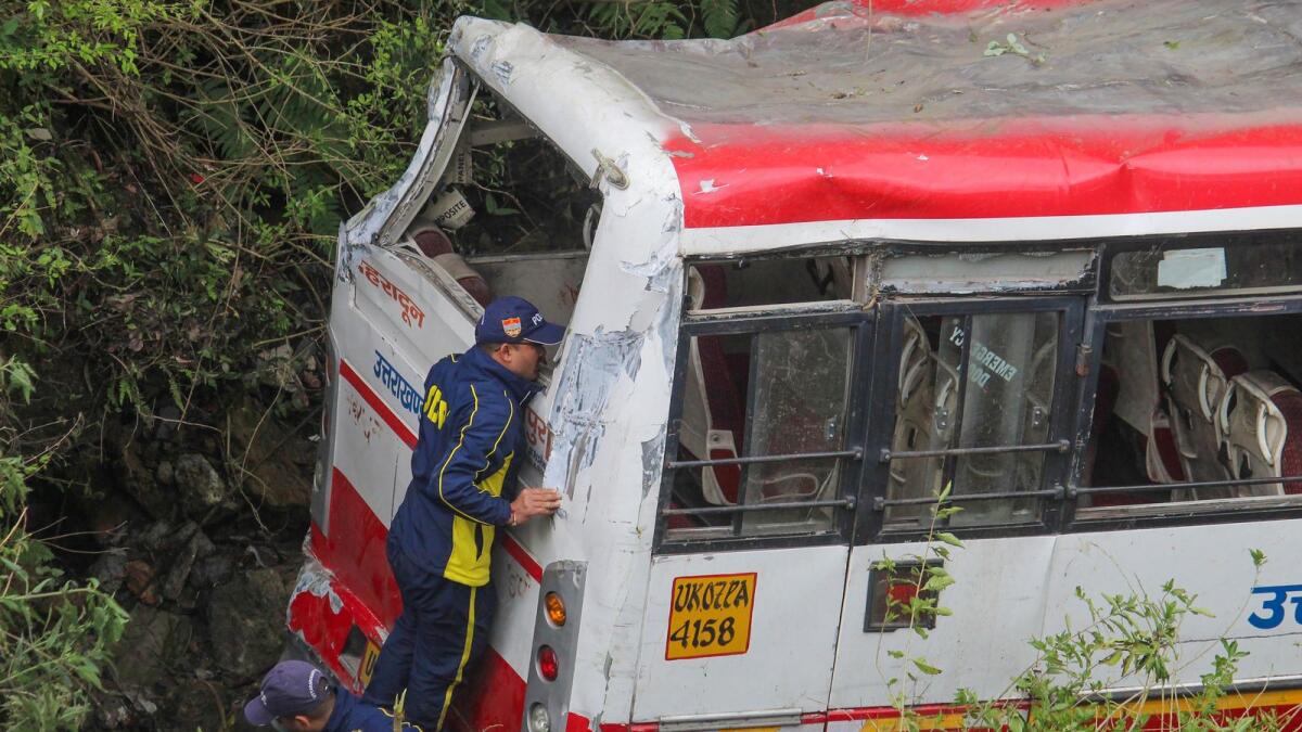 Rescue operation underway after a bus fell into a gorge in Mussoorie. — PTI
