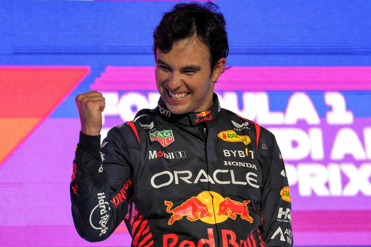 Red Bull Racing's Mexican driver Sergio Perez celebrates on the podium. — AFP