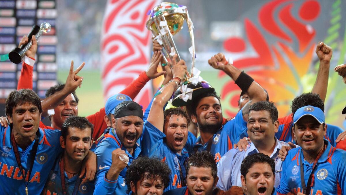 Indian players celebrate with the trophy after beating Sri Lanka in the 2011 World Cup final. (AFP file)