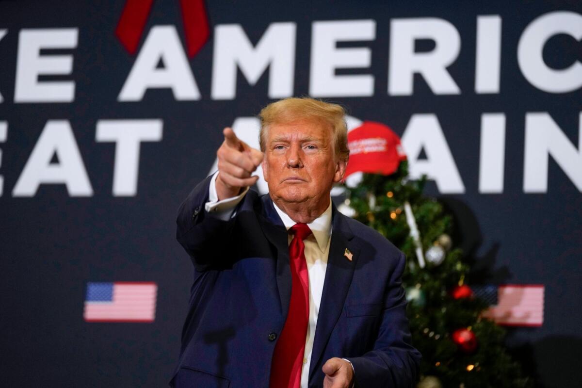 Former President Donald Trump points to supporters during rally on December 19, 2023 in Waterloo, Iowa. — AP file