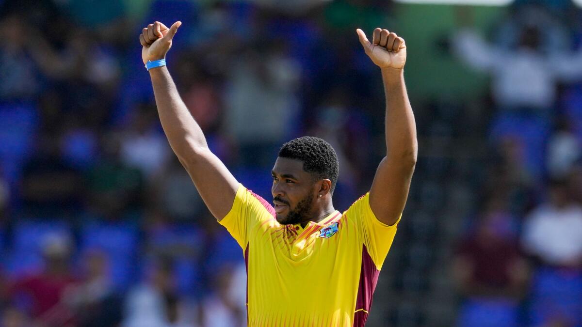 West Indies pace' Obed McCoy celebrates after dismissing India's Ravichandran Ashwin during the second T20 at Warner Park in Basseterre, St. Kitts and Nevis, on Monday. — AP