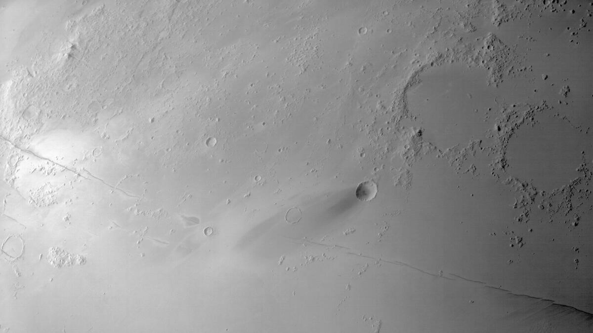A monochromatic image of the Cerberus Fossae with a spatial scale of approximately 180 meters/pixel.