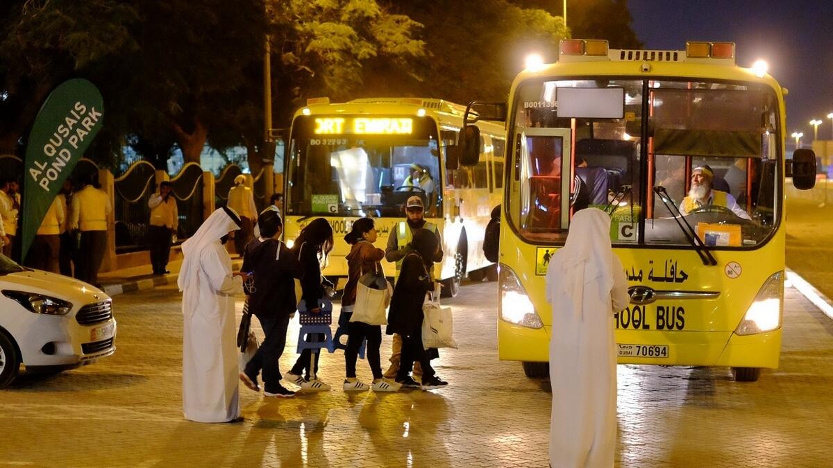 People boarding the bus from Al Qusais Pond Park, to attend the papal mass in Abu Dhabi.- Photo by Shihab