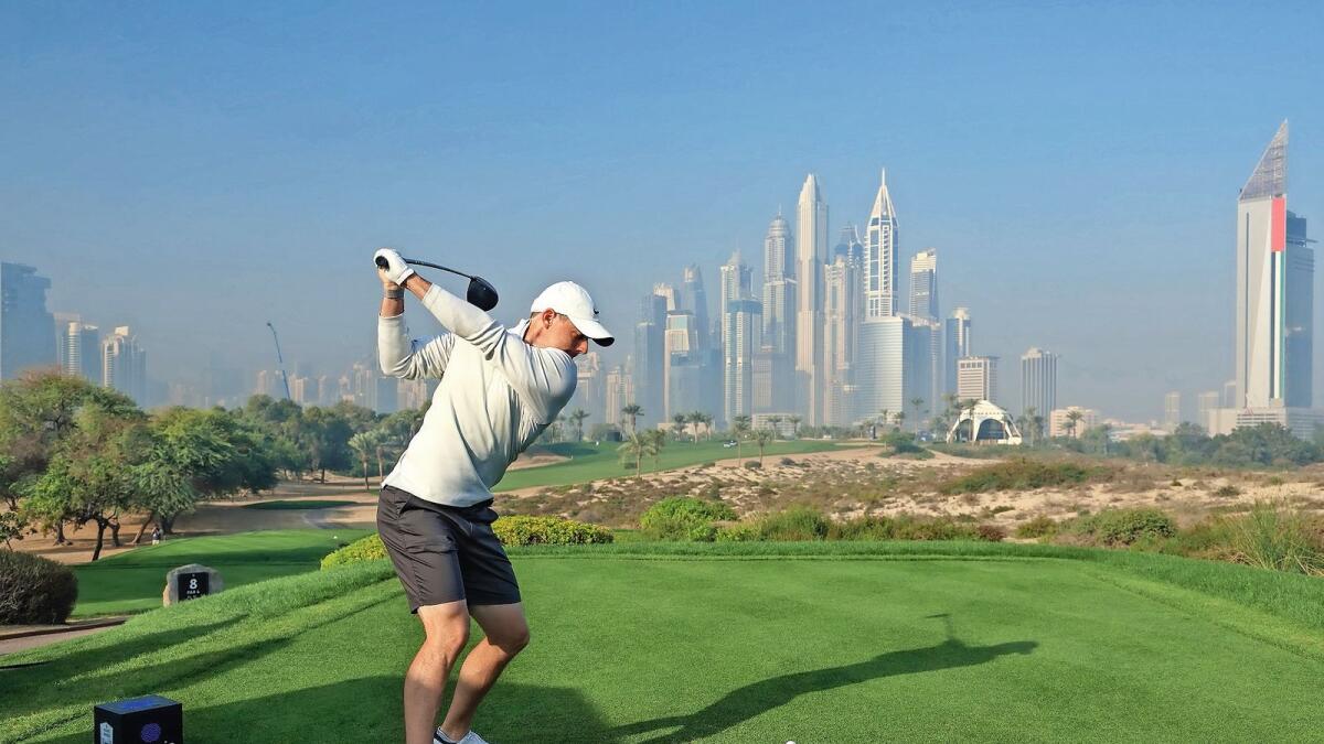 Good feelings: Four-time Major winner Rory McIlroy tees off against the stunning backdrop of the picturesque Dubai skyline ahead of the Slync.io Dubai Desert Classic at the Majlis Course at Emirates Golf Club on Wednesday. — Supplied photo