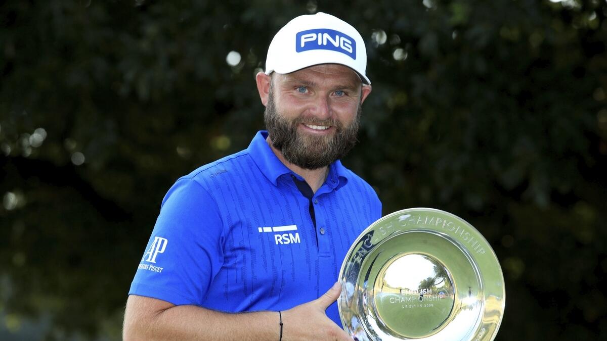 England's Andy Sullivan celebrates winning the English Championship on day four of the English Championship at Hanbury Manor Marriott Hotel and Country Club, Ware, England