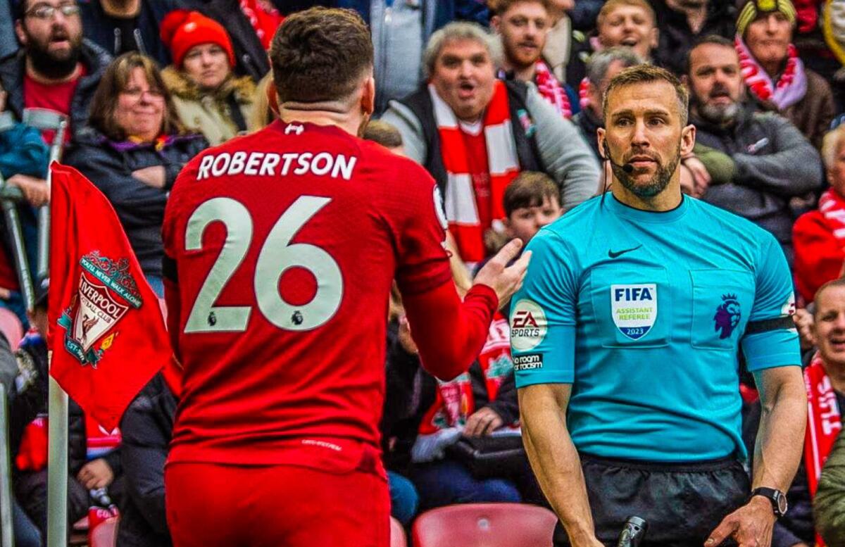 Liverpool's Andy Robertson argues with the linesman during the match against Arsenal. — Twitter