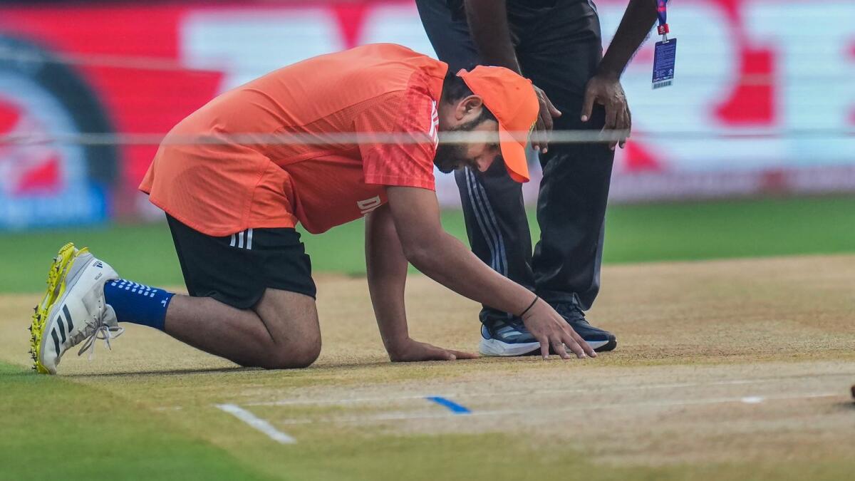 India's captain Rohit Sharma inspects the pitch. — PTI