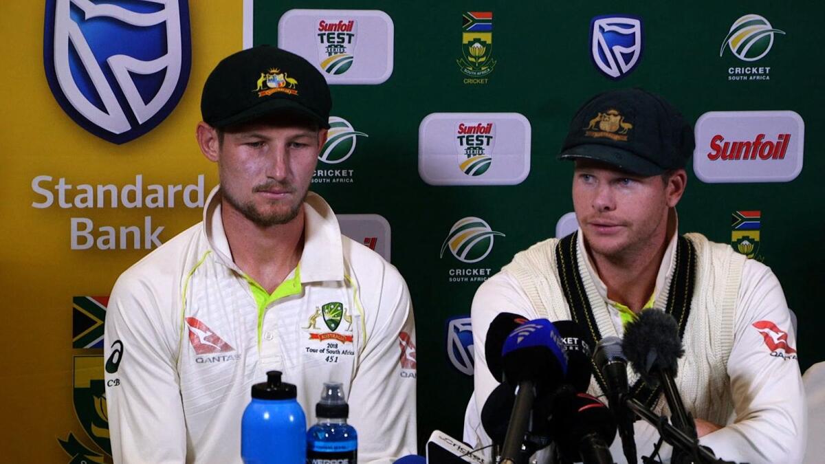 Australia's Steve Smith (right) and Cameron Bancroft during a press conference in Cape Town, on March 24, 2018. Smith and Bancroft sensationally admitted to ball-tampering during the third Test against South Africa. (AFP file)
