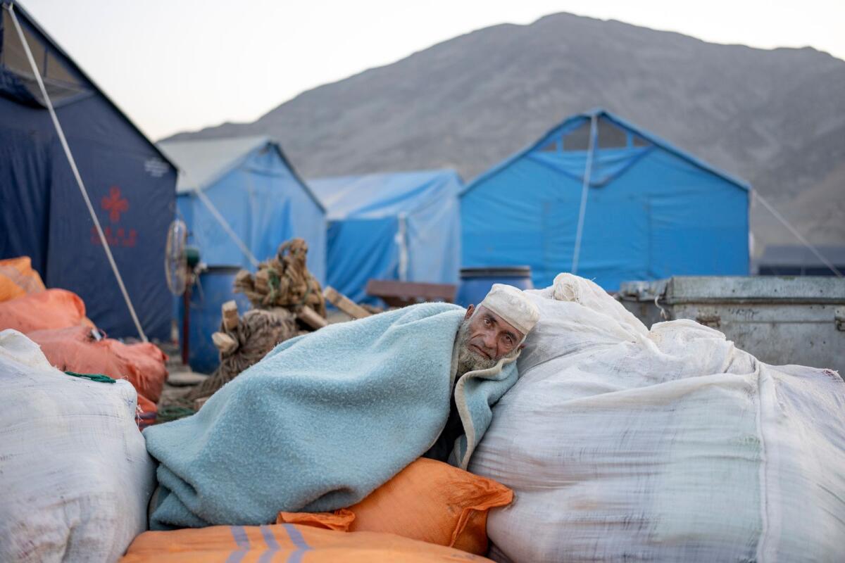 An Afghan refugee rests in a camp near the Torkham Pakistan-Afghanistan border in Torkham, Afghanistan, Saturday, Nov. 4, 2023. — AP
