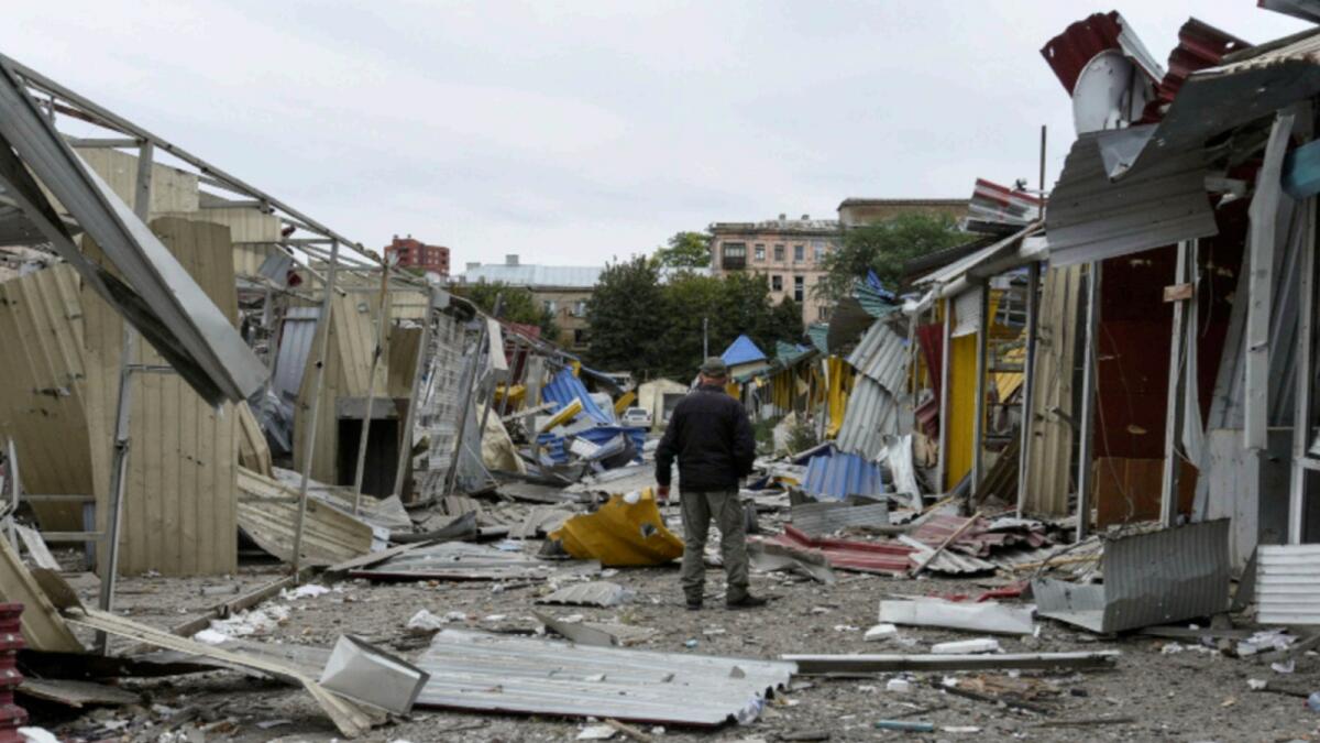 A man stands in a market destroyed by a Russian missile strike in central Dnipro. — Reuters