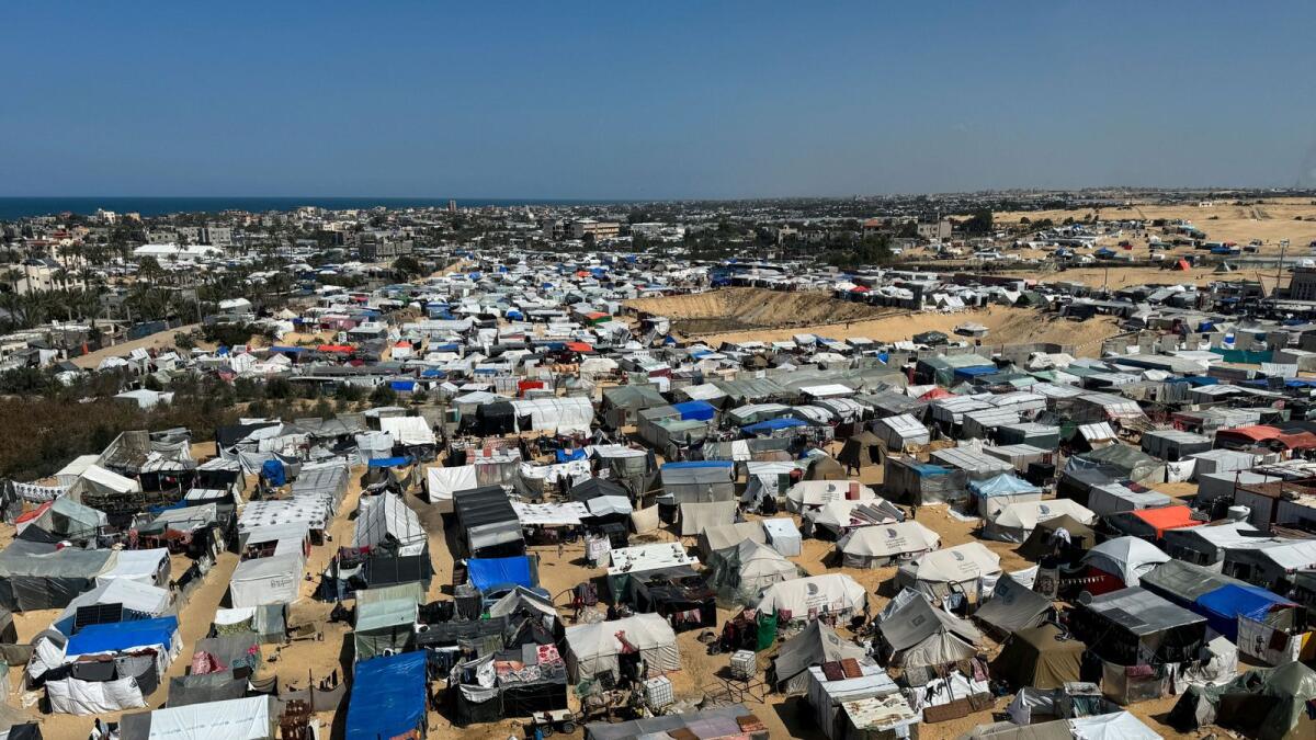 Displaced Palestinians, who fled their houses due to Israeli strikes, shelter in a tent camp in Rafah. — Reuters