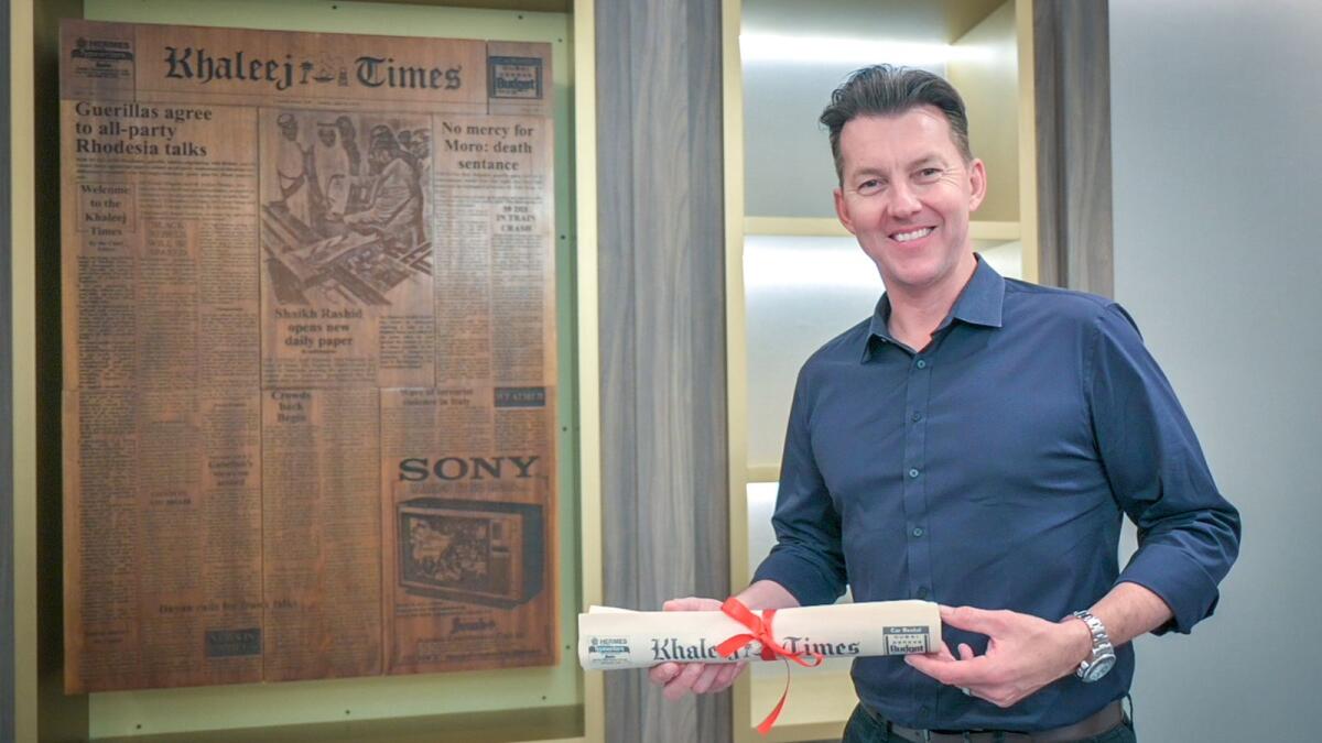 Former Australian fast bowler Brett Lee holds a copy of the first edition of the Khaleej Times at the Galadari headquarters in Dubai on Monday. (Photo by Rahul Gajjar)