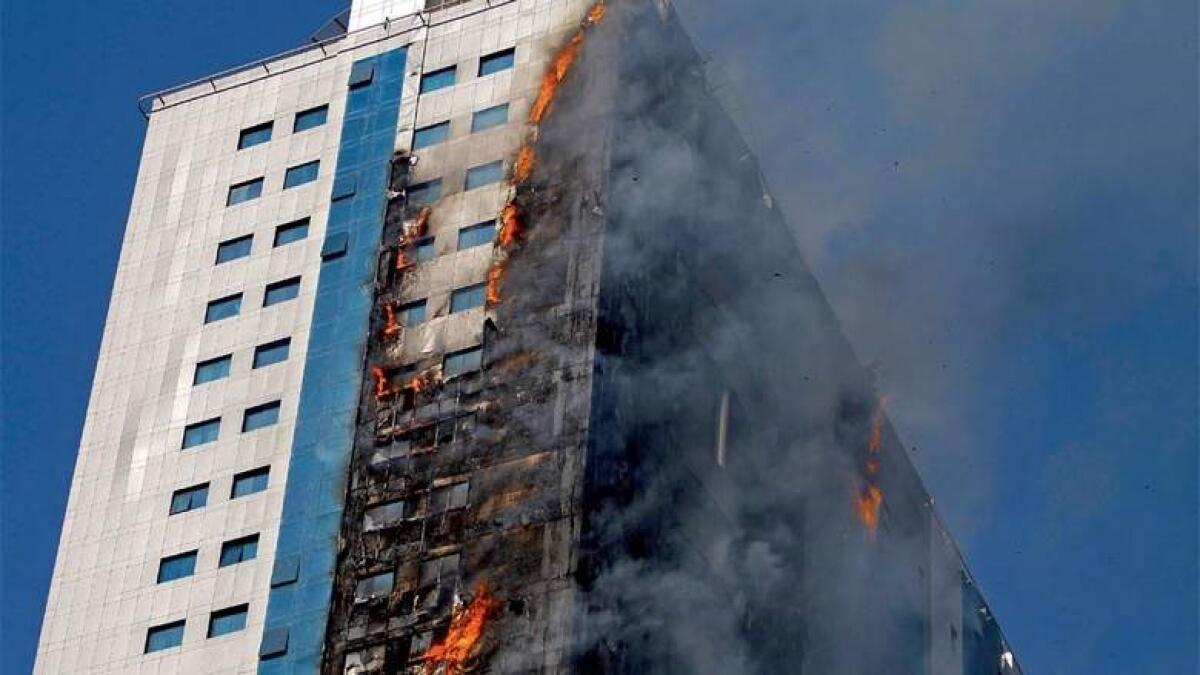 The residential building on fire at King Faisal Street in Sharjah on Thursday. (Photo by M. Sajjad )