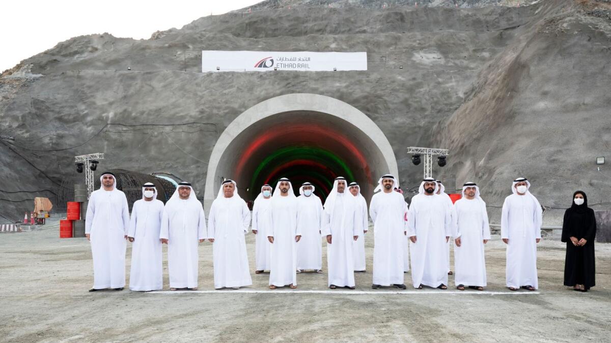 Sheikh Hamad bin Mohamed Al Sharqi, Sheikh Mohamed bin Hamad Al Sharqi, Sheikh Theyab bin Mohamed bin Zayed Al Nahyan and other officials attend a ceremony to mark the completion of tunnel excavation in stage two of the Etihad Rail project. — Wam