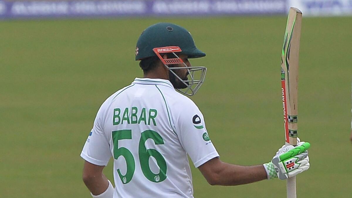 Pakistan captain Babar Azam celebrates after scoring a half-century. (AFP)