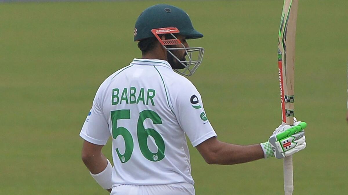 Pakistan captain Babar Azam celebrates after scoring a half-century. (AFP)